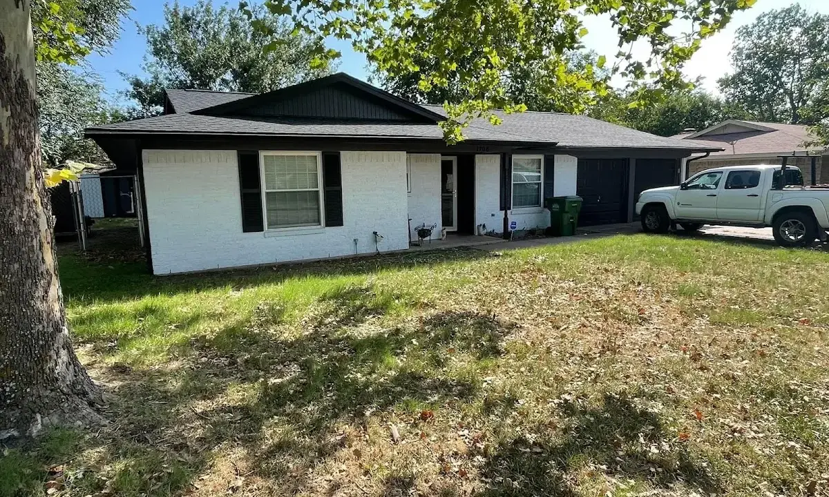 Professional roofing crew working on a residential roof in Beachwood